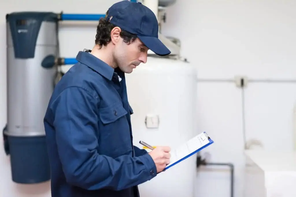 plumber installing a water heater