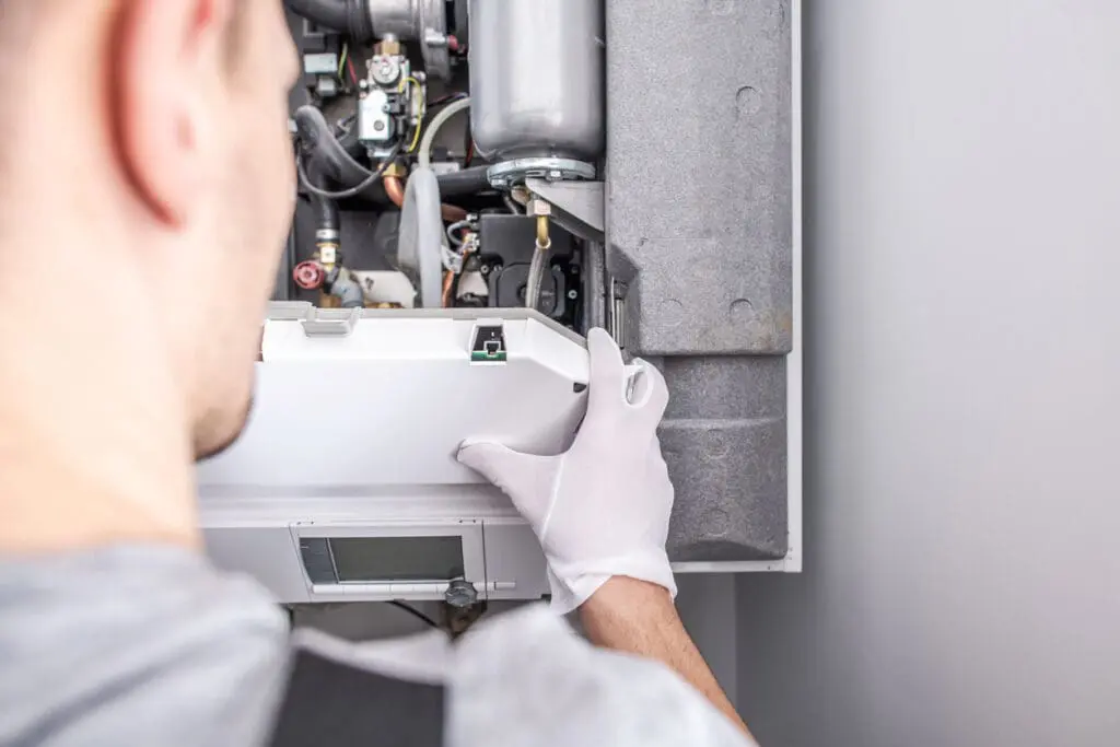 Service Worker Fixing Central Heating Furnace System