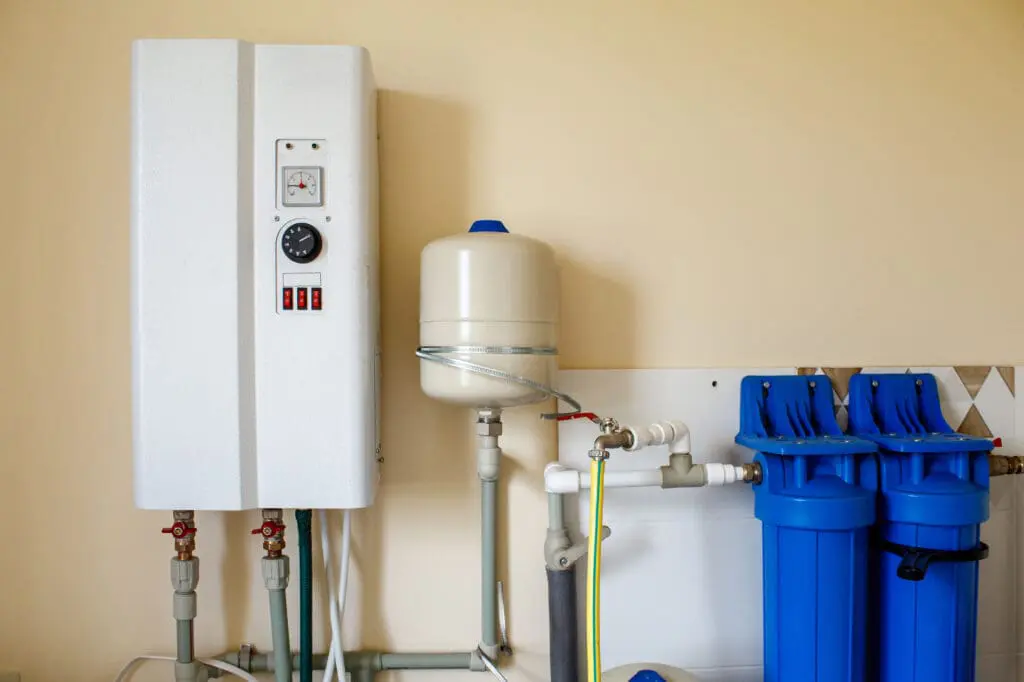 tankless water heater mounted on a wall for heating water indoors