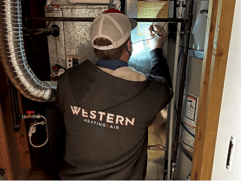 Western Technician Fixing Furnace