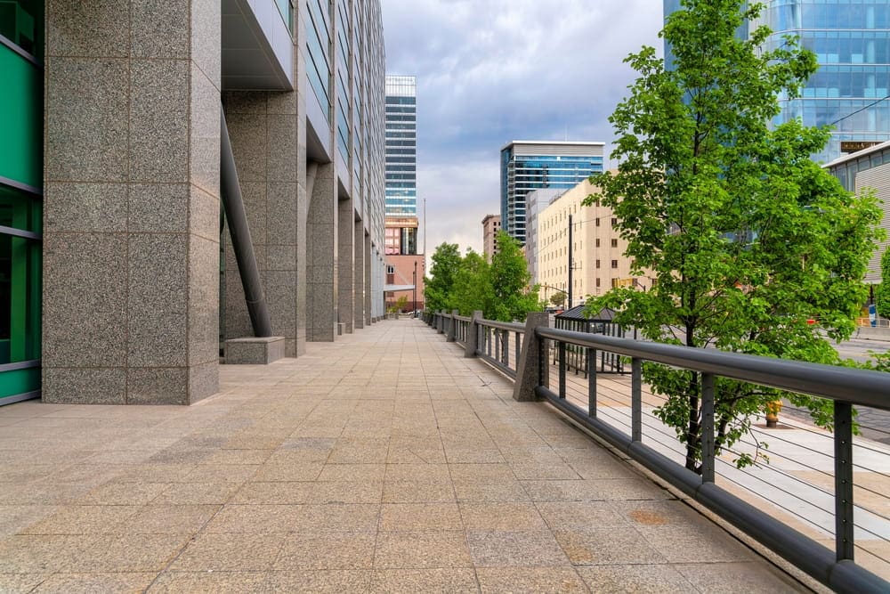 Deck with granite flooring and cable railings at the front of the building in Salt Lake City, Utah