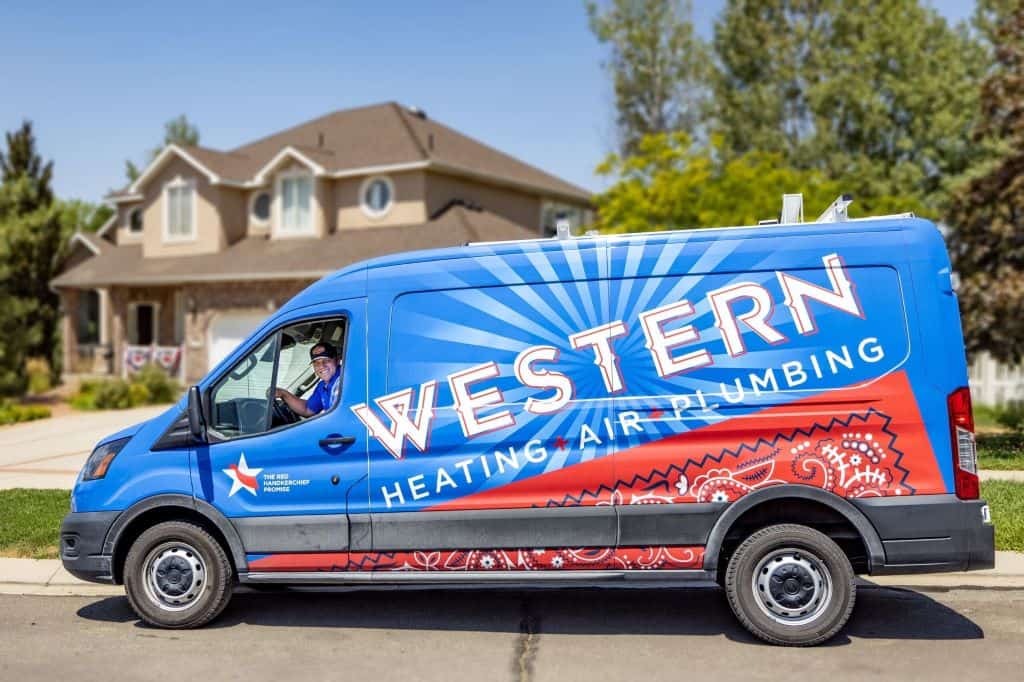 Commercial HVAC Services Sandy UT - Western Heating, Air & Plumbing Western Heating, Air & Plumbing commercial HVAC service vehicle parked outside a home in Sandy, UT.